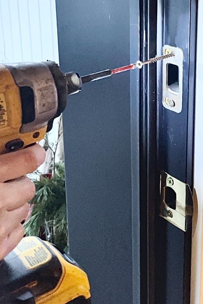 Replacing the screws on the front door strike plate