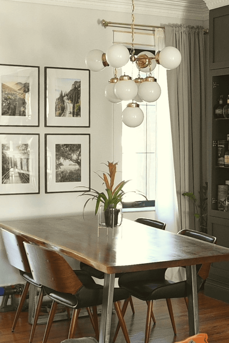 Dining room with midcentury furniture and globe chandelier