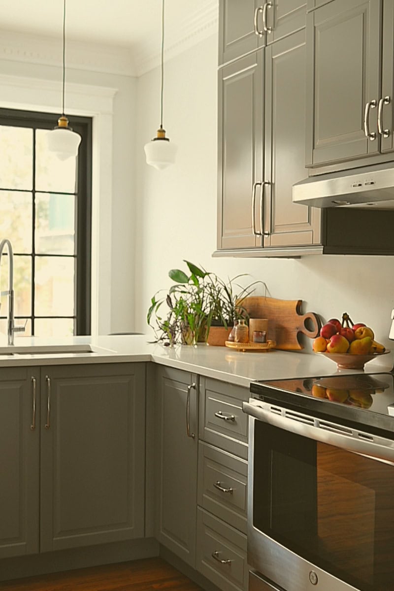 Kitchen with grey cupboards and factory-style patio door