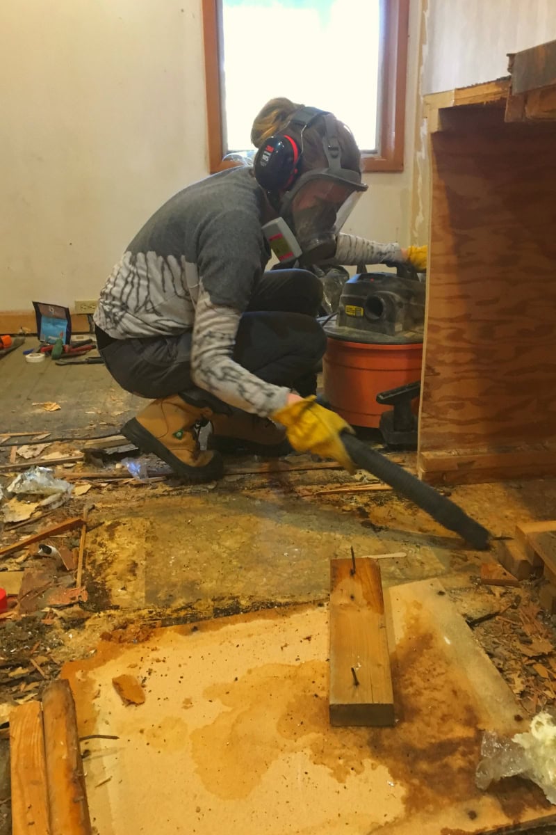Using a shop vac to clean up a jobsite