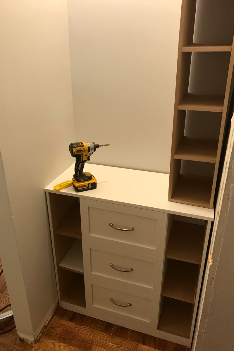 Custom built-in cabinetry in coat closet